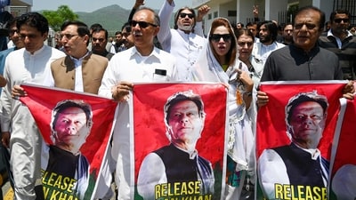 Parliamentarians of the Pakistan Tehreek-e-Insaf (PTI) party, carry posters of jailed former prime minister Imran Khan, during a protest outside the Parliament house in Islamabad on July 18, 2024. (AFP) Parliamentarians of the Pakistan Tehreek-e-Insaf (PTI) party, carry posters of jailed former prime minister Imran Khan, during a protest outside the Parliament house in Islamabad on July 18, 2024. (AFP)