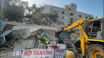 PMRDA carried out a major anti-encroachment drive on Monday to address the persistent traffic congestion near Navale Bridge. (HT)