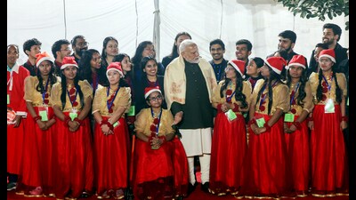 Prime Minister Narendra Modi during a group picture with artists at the Christmas celebrations hosted by the Catholic Bishops' Conference of India (CBCI), at the CBCI Centre premises in New Delhi on Monday. (ANI PHOTO) Prime Minister Narendra Modi during a group picture with artists at the Christmas celebrations hosted by the Catholic Bishops' Conference of India (CBCI), at the CBCI Centre premises in New Delhi on Monday. (ANI PHOTO)