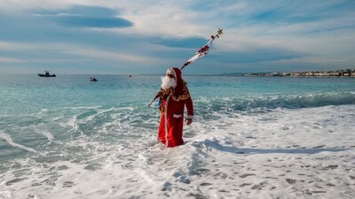 A bather dressed as Santa Claus takes part in the traditional Christmas bath in Nice, on the French Riviera, on December 22, 2024. (AFP) A bather dressed as Santa Claus takes part in the traditional Christmas bath in Nice, on the French Riviera, on December 22, 2024. (AFP)