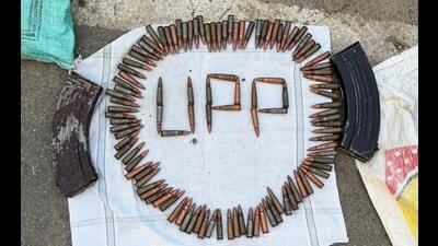 The police display the arms haul after the encounter. The police display the arms haul after the encounter.
