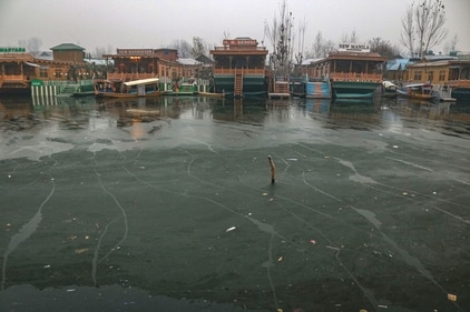 A view of a frozen surface parts of Dal Lake in Srinagar,on 21 December 2024. Kashmir is in the grip of a cold wave and the 40-day period of Chillai Kalan (major cold) began in the Valley on an icy note with Srinagar witnessing temperatures of -8.5 degrees Celsius, the coldest in 34 years for the same period. All other parts of Kashmir also witnessed sub-zero temperatures (Waseem Andrabi /Hindustan Times)