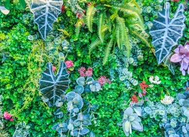 Artificial flower walls are preferred for longer events as the satin flower won't wilt like fresh flowers. (PC: Ferns N Petals) Artificial flower walls are preferred for longer events as the satin flower won't wilt like fresh flowers. (PC: Ferns N Petals)