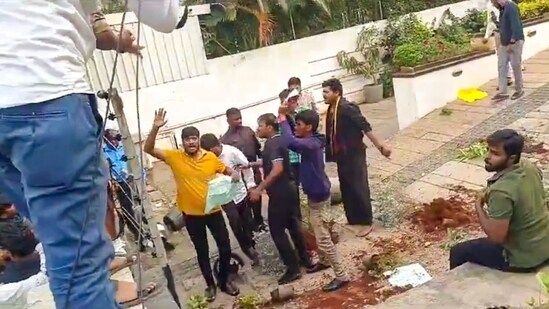 A group of protestors at the residence of Telugu actor Allu Arjun, in Hyderabad, Telangana, Sunday, Dec. 22, 2024. (PTI)