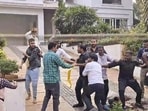 A group of protestors at the residence of Telugu actor Allu Arjun in Hyderabad, Telangana, on Sunday. (PTI) A group of protestors at the residence of Telugu actor Allu Arjun in Hyderabad, Telangana, on Sunday. (PTI)