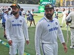 India's captain Rohit Sharma, right, and teammate Virat Kohli leave the field