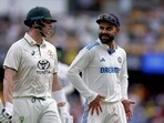 Australia's Steve Smith (L) talks with India's Virat Kohli as they walk off the ground for the tea break on day two of the third cricket Test match at The Gabba in Brisbane. Australia's Steve Smith (L) talks with India's Virat Kohli as they walk off the ground for the tea break on day two of the third cricket Test match at The Gabba in Brisbane.