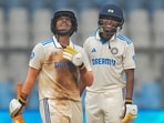 Deepti Sharma celebrates her half-century with Pooja Vastrakar on the second day of the one-off Test cricket match between India Women and Australia at the Wankhede Stadium in Mumbai,