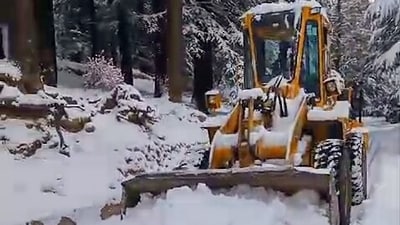A snow-clearing machine worked to open paths after heavy snowfall in Uttarakhand on Tuesday, as fresh snow covered regions like Badrinath, Kedarnath, Gangotri, Yamunotri, Hemkund Sahib in Garhwal Himalayas, and Munsiyari in Kumaon, intensifying the cold across the state. (Uttarakhand DIPR-X) A snow-clearing machine worked to open paths after heavy snowfall in Uttarakhand on Tuesday, as fresh snow covered regions like Badrinath, Kedarnath, Gangotri, Yamunotri, Hemkund Sahib in Garhwal Himalayas, and Munsiyari in Kumaon, intensifying the cold across the state. (Uttarakhand DIPR-X)
