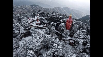 An aerial view of snow-covered statue of lord Hanuman at Jakhoo hill after fresh snowfall in Shimla on Tuesday. (Deepak Sansta) An aerial view of snow-covered statue of lord Hanuman at Jakhoo hill after fresh snowfall in Shimla on Tuesday. (Deepak Sansta)
