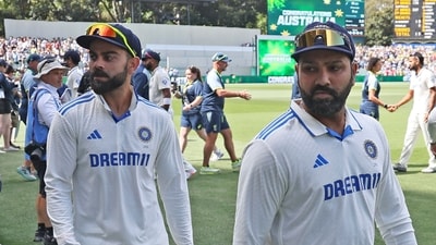 India's captain Rohit Sharma, right, and teammate Virat Kohli leave the field (AP) India's captain Rohit Sharma, right, and teammate Virat Kohli leave the field (AP)