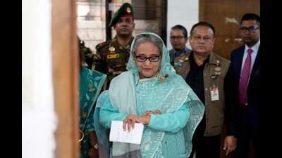 Bangladesh former Prime Minister Sheikh Hasina checks her watch as she waits for the official opening time to cast her vote in Dhaka, Bangladesh, Jan. 7, 2024. (AP Photo/Altaf Qadri) (AP) Bangladesh former Prime Minister Sheikh Hasina checks her watch as she waits for the official opening time to cast her vote in Dhaka, Bangladesh, Jan. 7, 2024. (AP Photo/Altaf Qadri) (AP)