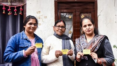 Beneficiaries with the card under the 'Mahila Samman Yojana' program. (ANI)