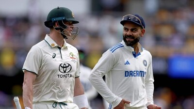 Australia's Steve Smith (L) talks with India's Virat Kohli as they walk off the ground for the tea break on day two of the third cricket Test match at The Gabba in Brisbane. (AFP) Australia's Steve Smith (L) talks with India's Virat Kohli as they walk off the ground for the tea break on day two of the third cricket Test match at The Gabba in Brisbane. (AFP)