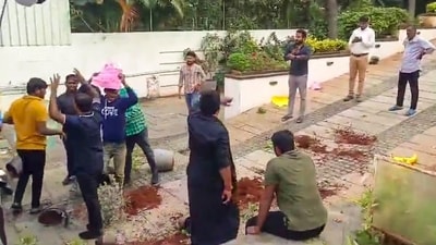 A group of protestors at the residence of Allu Arjun, in Hyderabad, Telangana on Sunday, December 22, 2024. A group of persons, claiming to be members of Osmania University Joint Action Committee, on Sunday vandalised flower pots and other things at the residence of the Pushpa 2 star. (PTI) A group of protestors at the residence of Allu Arjun, in Hyderabad, Telangana on Sunday, December 22, 2024. A group of persons, claiming to be members of Osmania University Joint Action Committee, on Sunday vandalised flower pots and other things at the residence of the Pushpa 2 star. (PTI)