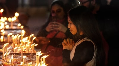 People gathered outside the church to ask for blessings ahead of Christmas on December 25 (PTI) People gathered outside the church to ask for blessings ahead of Christmas on December 25 (PTI)