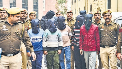 Police personnel with the accused arrested in the case of illegal Bangladeshi immigrants on Tuesday. (PTI) Police personnel with the accused arrested in the case of illegal Bangladeshi immigrants on Tuesday. (PTI)