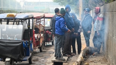 After light rain in the morning, people are standing around bonfires to protect themselves from the cold. (Sunil Ghosh/Hindustan Times) After light rain in the morning, people are standing around bonfires to protect themselves from the cold. (Sunil Ghosh/Hindustan Times)