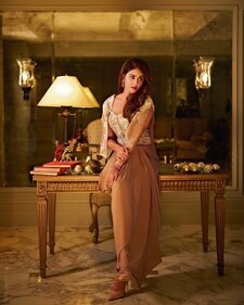 Outfit: Rishi & Soujit
Genelia in a pearl-work corset and drape skirt.

Jewellery: Virrayaa jewellery 
Statement earrings featuring rubies and polkis. (Photo: Rohn Pingalay)