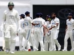 India's Jasprit Bumrah (R) celebrates with teammates after bowling Australia's Usman Khawaja (L) on day five of the third cricket Test match. India's Jasprit Bumrah (R) celebrates with teammates after bowling Australia's Usman Khawaja (L) on day five of the third cricket Test match.