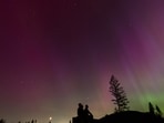 Christmas Day will feature a geomagnetic storm, enhancing the visibility of the Northern Lights for millions in 10 U.S. states. (AP Photo/Jenny Kane, File)