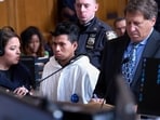 Sebastian Zapeta-Calil, in white, appears at an arraignment hearing in New York on Tuesday, December 24. Curtis Means/Pool via AP