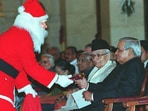 Former PM Atal Bihari Vajpayee receiving a Christmas gift from Santa Claus.