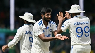 India's Jasprit Bumrah (C) celebrates with teammate Ravichandran Ashwin (R) (AFP) India's Jasprit Bumrah (C) celebrates with teammate Ravichandran Ashwin (R) (AFP)