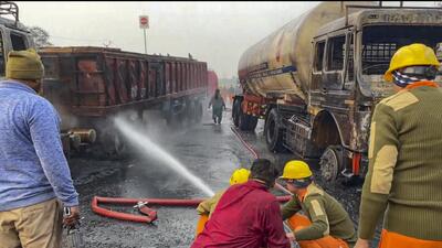 Firefighters extinguish the blaze at the site of the accident where a truck collided with several other vehicles on the Jaipur-Ajmer highway on Friday. (PTI Photo) Firefighters extinguish the blaze at the site of the accident where a truck collided with several other vehicles on the Jaipur-Ajmer highway on Friday. (PTI Photo)