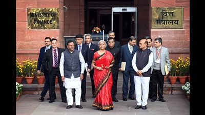 New Delhi, India - Feb. 1, 2023: Union Finance Minister Nirmala Sitharaman with Ministers of State Bhagwat Kishanrao Karad and Pankaj Chaudhary and officials poses for photographs outside the Finance Ministry ahead of the presentation of the Union Budget 2023-24 at North Block in New Delhi, India, on Wednesday, February 1, 2023. (Photo by Ajay Aggarwal/ Hindustan Times) (Hindustan Times) New Delhi, India - Feb. 1, 2023: Union Finance Minister Nirmala Sitharaman with Ministers of State Bhagwat Kishanrao Karad and Pankaj Chaudhary and officials poses for photographs outside the Finance Ministry ahead of the presentation of the Union Budget 2023-24 at North Block in New Delhi, India, on Wednesday, February 1, 2023. (Photo by Ajay Aggarwal/ Hindustan Times) (Hindustan Times)