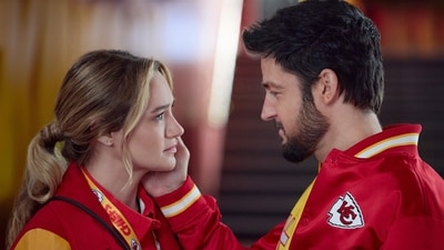 This image released by Hallmark Media shows Hunter King, left, and Tyler Hynes in a scene from "Holiday Touchdown: A Chiefs Love Story. (Joshua Haines/Hallmark Media via AP) (AP)