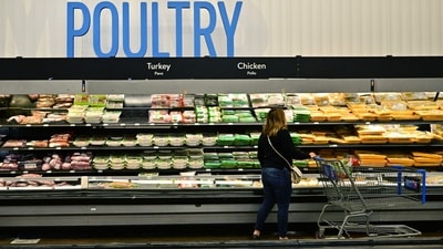 A shopper browses near the poultry section at a Walmart in Rosemead, California on December 19, 2024 (Photo by Frederic J. BROWN / AFP) (AFP)