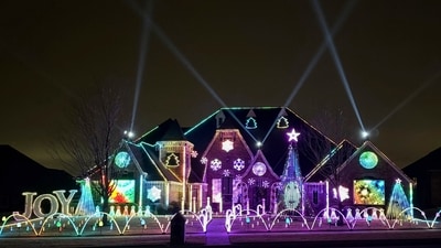 An elaborate holiday light display featuring music and imagery from the movie "Wicked" lights up the home of Elisabeth and Mark Miranda in Edmond. (AP) An elaborate holiday light display featuring music and imagery from the movie "Wicked" lights up the home of Elisabeth and Mark Miranda in Edmond. (AP)