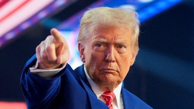 U.S. President-elect Donald Trump gestures at Turning Point USA's AmericaFest in Phoenix, Arizona, U.S., December 22, 2024. (REUTERS)