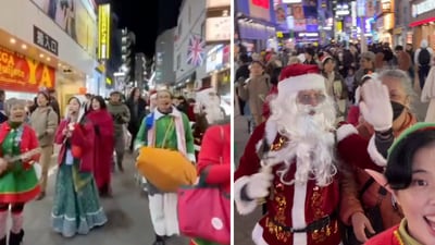 In a video, a large group of Iskcon followers dressed in green elf outfits or wearing reindeer ears strum a ukelele and beat a mridangam (Instagram/@stayhighforeverrrr) In a video, a large group of Iskcon followers dressed in green elf outfits or wearing reindeer ears strum a ukelele and beat a mridangam (Instagram/@stayhighforeverrrr)