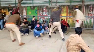 Police personnel doing lathi charge on protesters sitting on dharna demanding 70th CCE prelims re-exam at the BPSC office at Nehru Path in Patna, (Photo by Santosh Kumar)