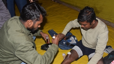Protester showing injury after lathi charge on him during dharna for re-exam at Gardanibagh in Patna. (Photo by Santosh Kumar)