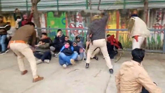 Police personnel doing lathi charge on protesters sitting on dharna demanding 70th CCE prelims re-exam at the BPSC office at Nehru Path in Patna,(Photo by Santosh Kumar)