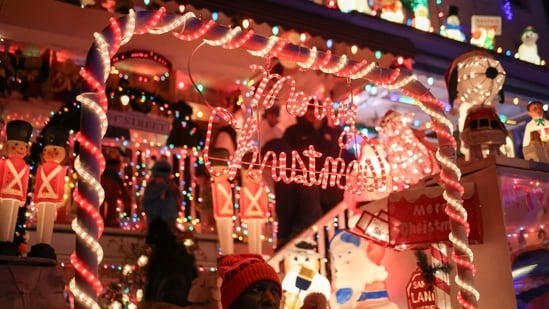 People look at Christmas lights decorations in the Hampden area of Baltimore, Maryland, US. Christmas marks the birth of Jesus Christ, central to Christian faith, traditionally observed on December 25.(REUTERS)