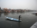 A boatman makes his way through the frozen surface of Dal Lake on a cold morning in Srinagar on December 25, 2024. A boatman makes his way through the frozen surface of Dal Lake on a cold morning in Srinagar on December 25, 2024.