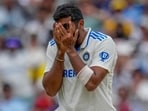 India's Jasprit Bumrah reacts as he celebrates the wicket of Australia's Usman Khawaja during play at the Melbourne Cricket Ground.