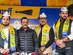 AAP National Convener Arvind Kejriwal with Akshay Dilawari, Tilak Raj, and Rohit Dalal, who are associated with the field of sports and fitness, as they join the party, in New Delhi, Thursday.