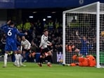 Fulham's Welsh midfielder Harry Wilson scores the equalising goal.