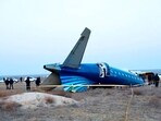 In this photo taken from a video released by the administration of Mangystau region, a part of Azerbaijan Airlines' Embraer 190 lies on the ground near the airport of Aktau, Kazakhstan. In this photo taken from a video released by the administration of Mangystau region, a part of Azerbaijan Airlines' Embraer 190 lies on the ground near the airport of Aktau, Kazakhstan.
