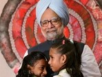 **EDS: FILE PHOTO: In this Aug. 24, 2010 photo, Prime Minister Manmohan Singh hugs two girls as he celebrates "Raksha Bandhan" with children in New Delhi on Tuesday. (PTI Photo/Vijay Verma)(PTI12_27_2024_000008A)