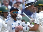 Usman Khawaja (L) tried to diffuse the situation between Virat Kohli and Sam Konstas Usman Khawaja (L) tried to diffuse the situation between Virat Kohli and Sam Konstas