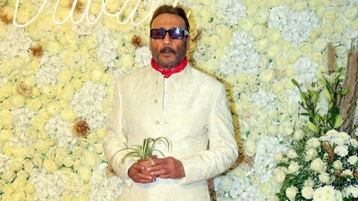 Jackie Shroff helped fan who fell down while clicking his picture. Jackie Shroff helped fan who fell down while clicking his picture.