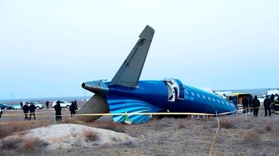 In this photo taken from a video released by the administration of Mangystau region, a part of Azerbaijan Airlines' Embraer 190 lies on the ground near the airport of Aktau, Kazakhstan. (AP) In this photo taken from a video released by the administration of Mangystau region, a part of Azerbaijan Airlines' Embraer 190 lies on the ground near the airport of Aktau, Kazakhstan. (AP)