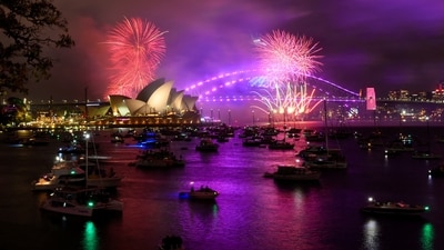 2. Sydney, Australia - Early fireworks explode over Sydney Opera House during the New Year's Eve celebrations, in Sydney, Australia.Sydney's harbor fireworks display is legendary, with breathtaking views of the Sydney Opera House and Harbour Bridge. The city's warm summer weather also adds to the allure. (REUTERS/Jaimi Joy)