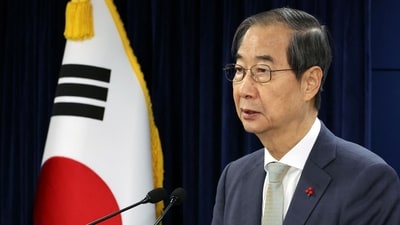 The largest opposition party in South Korea said that it would present a measure to remove acting President Han Duck-soo from office. (REUTERS)